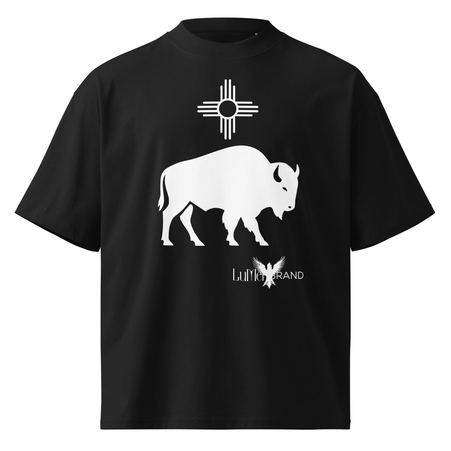 Black t-shirt featuring a centered white buffalo with a white Zia sun symbol above it and the LuMen Brand logo with a soaring bird positioned diagonally below and to the side. A symbolic design representing power, origin, and transformation, rooted in the vision of LuMen: art, energy, and evolution.
